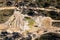 Drone aerial photograph of flood water on a dirt road in a forest