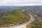 Drone aerial photograph of a highway running through a forest in regional Australia