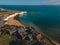 Drone aerial shot of Empty Kingsgate Beach and Castle on the cliffs above the Bay, on cloudy autumn morning