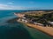 Drone aerial shot of Empty Kingsgate Beach and Castle on the cliffs above the Bay, on cloudy autumn morning