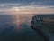 Drone aerial shot of Remains of Reculver church towers at early october sunrise  early october sunrise