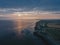 Drone aerial shot of Remains of Reculver church towers at early october sunrise  early october sunrise