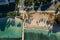 Drone, aerial shot of Waikiki beach with palm trees shadows in the morning sun