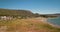 Drone aerial view above camping site on lake shore