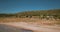 Drone aerial view above camping site on lake shore