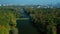 Drone aerial view on beautiful autumn colorful trees, ponds in Moscow park Botanicheskiy sad and city in the background