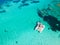 Drone aerial view of catamaran sailing boat in Maddalena Archipelago, Sardinia, Italy.