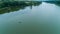 Drone aerial view fisherman is fishing sitting on an inflatable boat in lake