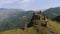 Drone aerial view. Historic watchtowers in Tusheti, Georgia. Old towers made of natural stone