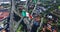 Drone-aerial view of a huge mexican flag fluttering, just outside Mexico City. A highway and some suburbs in the back. TAKE 2