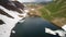 Drone aerial view of the Lake Branchino an Alpine natural lake during spring season. Italian Alps. Italy