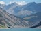 Drone aerial view of the Lake Livigno an alpine artificial lake and the road protected by avalanches. Italian Alps. Italy