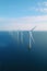 drone aerial view of windmill turbines generating green energy electric.AI Generated