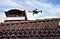 Drone in the air inspecting the roof over the house. Close-up of drone and roof