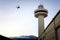 Drone aircraft hovers near control tower, Hobart.