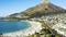 Drone, beach and sea waves with crowd on summer vacation, holiday or travel in South Africa. Aerial view, water and