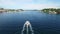 Drone, boat and cruise speed on lake, travel and landscape on water, yacht and fast on river. Overhead, holiday and