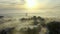 Drone, buildings and city in sunrise with fog, ocean and clouds with landscape, metro skyline and horizon. Outdoor