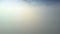 Drone camera descends through thick white foggy cloud
