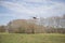 Drone with a camera flying over a field
