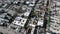 Drone camera rises above roofs of the city in Los Angeles, California, USA