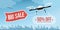Drone carrying a shopping sale banner in the sky
