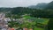 Drone countryside slopes rainy weather nature. Small houses at valley landscape