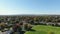 Drone crane shot video over a soccer field of the Riviere-Nord public park in St-Eustache at the beginning of Autumn