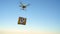 Drone delivering package on the sky background. Slow motion