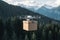 Drone delivers goods over forested mountains in cardboard box