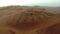 Drone, desert or car in sand landscape in Dubai for sunset, nature beauty on dry land, travel or Africa sahara. Hill