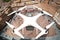Drone with digital camera flying over a square of an italian city
