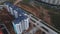 The drone dives over the new city block. Multi-storey buildings, the construction site is visible