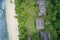 Drone field of view of chalets hidden among forest and waves in Praslin, Seychelles