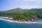 Drone field of view of coastline, mountains and beach in Praslin, Seychelles