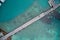 Drone field of view of road crossing turquoise blue water to harbour Praslin, Seychelles