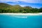 Drone field of view of speeding boat in turquoise water Curieuse Island, Seychelles