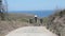 Drone filming a guy walking on a dirt road