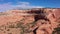 Drone Flies Near Orange Smooth Stone Massive Rock Formations In Desert Of Usa