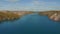 Drone flies over the blue river. Beautiful landscape with a meander river. Flying over a blue lake. Wild nature scene