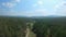 Drone flies over a couple walking on a country road