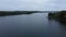 drone flies over lake and trees in autumn in belarus.