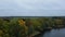 drone flies over lake and trees in autumn in belarus.