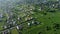 the drone flies over the village and the field