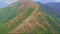 Drone Flies Slowly over Huge Brown Mountain Ridge