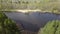 A drone flies through a small wooden bridge on the Teterev river, Ukraine