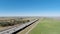 Drone Flight In Field Next To Freeway With Sacramento In Distance