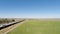 Drone Flight In Field Next To Freeway With Sacramento In Distance