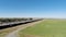 Drone Flight In Field Next To Freeway With Sacramento In Distance