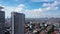 Drone flight forward. Aerial View of Jakarta Downtown Skyline with High-Rise Buildings With White Clouds and Blue Sky